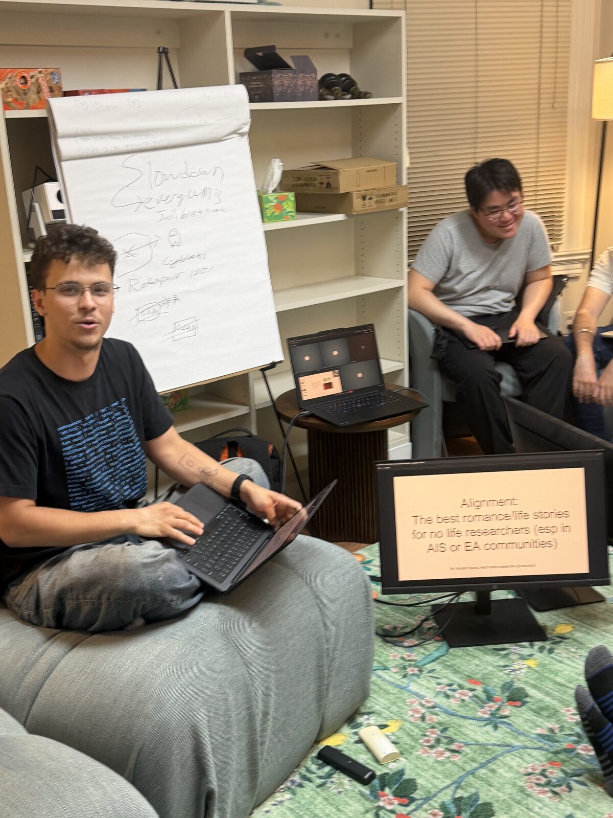 A talk in progress — a slide and a whiteboard of notes